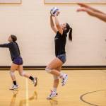 Cady Harmon, left, and Abbie Orr, right, run through warm up drills during practice at Lynnwood High School on Tuesday, Nov. 15, 2022 in Bothell, Washington. (Olivia Vanni / The Herald)