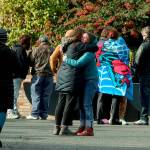 Parents comfort each other outside of Ingraham High School after reports of a school shooting on Nov. 8, in Seattle. (Greg Gilbert / The Seattle Times via AP)