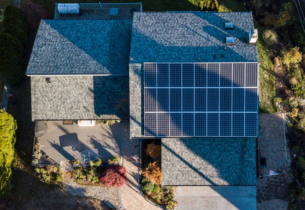 Solar panels are visible along the rooftop of the Crisp family home on Monday, in Everett. (Olivia Vanni / The Herald)