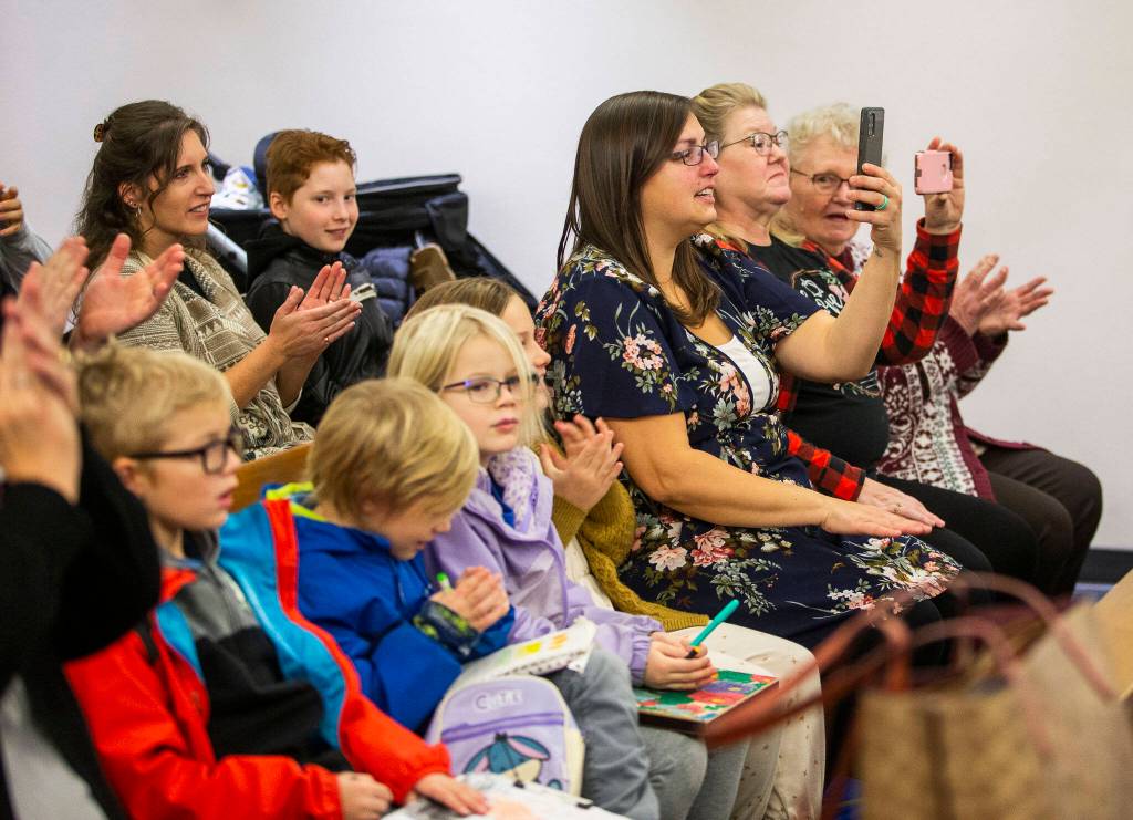 Family and friends of the Chadwick family fill the courtroom with applause after the adoption of Caysen is made official during Adoption Day at the Snohomish County Courthouse on Friday, in Everett. (Olivia Vanni / The Herald)