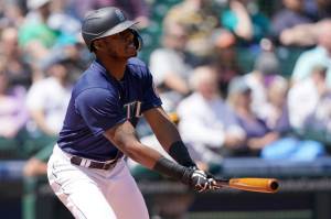 Seattle Mariners' Kyle Lewis watches his line-out during the second inning of a baseball game against the Oakland Athletics, Wednesday, May 25, 2022, in Seattle. (AP Photo/Ted S. Warren)
