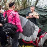 Everett Police officer Inci Yarkut, left, and COET social worker Kelli Roark, center, chat with Chris Portner, right, and his dog Gizzy at his encampment near I-5 and Marine View Drive during the annual Point in Time count on Wednesday, Jan. 23, 2019 in Everett, Wa. (Olivia Vanni / The Herald)