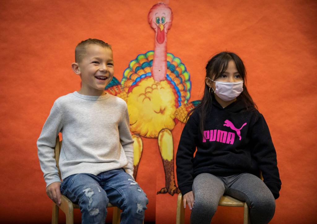 Kasen Clarke, left, and Chelsea Lopez-Romero, talk about what their favorite thanksgiving food is at Central Primary School on Tuesday, in Snohomish. (Olivia Vanni / The Herald)