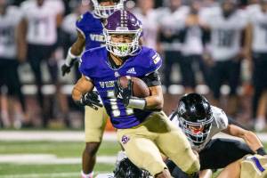 Lake Stevens’ Jayden Limar runs the ball during the game against Eastlake on Friday, Oct. 7, 2022 in Lake Stevens, Washington. (Olivia Vanni / The Herald)