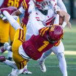 Stanwoods Ryder Bumgarner runs through a tackle during the 3A quarterfinal game against Odea on Saturday, Nov. 19, 2022 in Seattle, Washington. (Olivia Vanni / The Herald)
