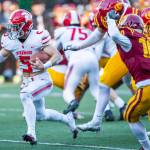 Stanwoods Ryder Bumgarner breaks free of multiple tackles while running the ball during the 3A quarterfinal game against Odea on Saturday, Nov. 19, 2022 in Seattle, Washington. (Olivia Vanni / The Herald)