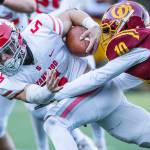 Stanwoods Ryder Bumgarner is tackled while running the ball during the 3A quarterfinal game against Odea on Saturday, Nov. 19, 2022 in Seattle, Washington. (Olivia Vanni / The Herald)
