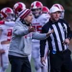 Stanwood head coach Jeff Scoma talks with the referees during the 3A quarterfinal game against Odea on Saturday, Nov. 19, 2022 in Seattle, Washington. (Olivia Vanni / The Herald)
