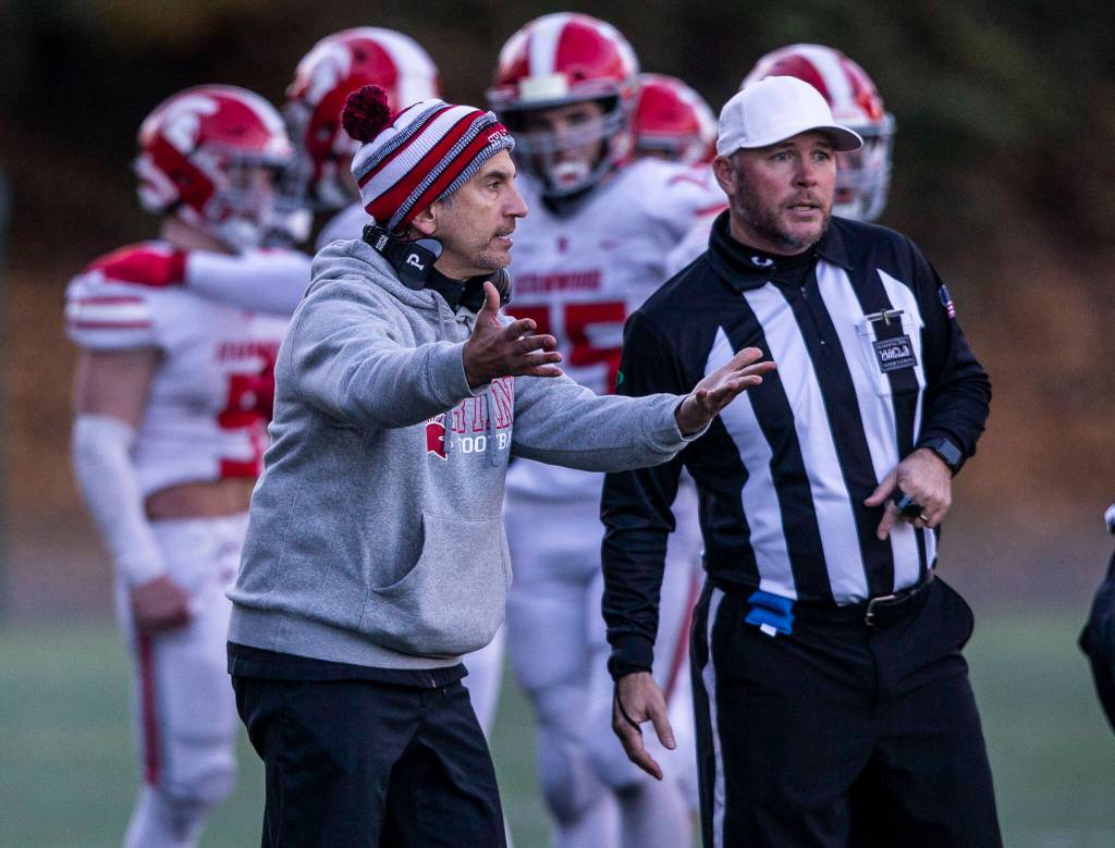 Stanwood head coach Jeff Scoma talks with the referees during the 3A quarterfinal game against Odea on Saturday, Nov. 19, 2022 in Seattle, Washington. (Olivia Vanni / The Herald)
