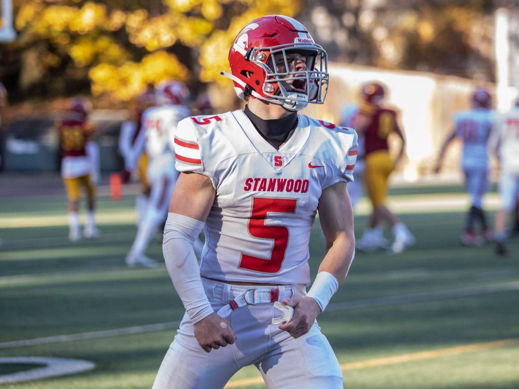 Stanwoods Ryder Bumgarner yells in celebration after scoring a touchdown during the 3A quarterfinal game against Odea on Saturday, Nov. 19, 2022 in Seattle, Washington. (Olivia Vanni / The Herald)