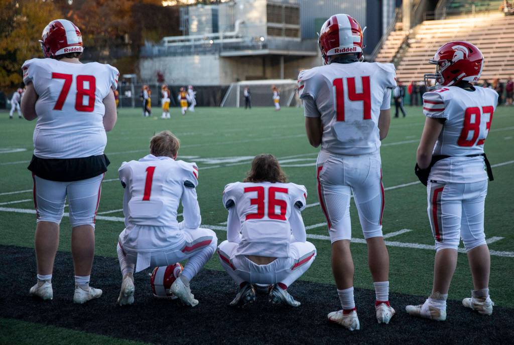 Stanwood players reacts to losing to Odea in the 3A quarterfinal game on Saturday, Nov. 19, 2022 in Seattle, Washington. (Olivia Vanni / The Herald)
