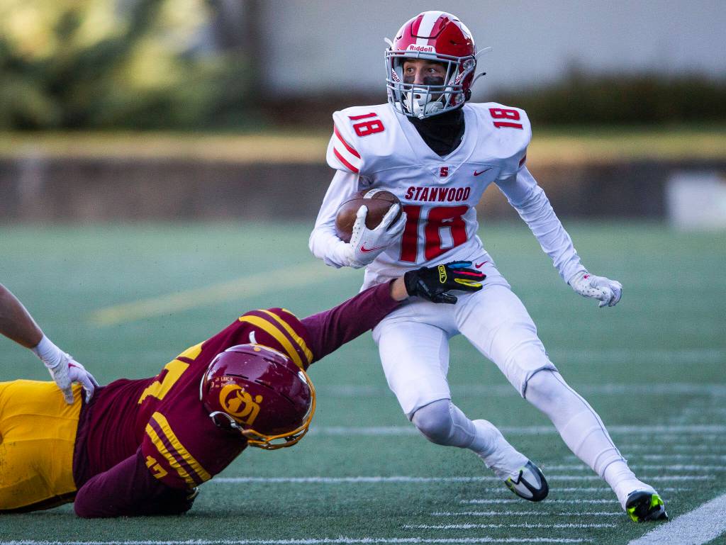 Stanwoods Max Mayo runs the ball during the 3A quarterfinal game against Odea on Saturday, Nov. 19, 2022 in Seattle, Washington. (Olivia Vanni / The Herald)