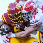 Stanwoods Otto Wiedmann grimaces while making a tackle during the 3A quarterfinal game against Odea on Saturday, Nov. 19, 2022 in Seattle, Washington. (Olivia Vanni / The Herald)