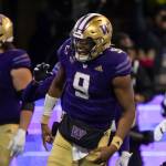 Washington quarterback Michael Penix Jr. celebrates a touchdown during the first half of a game against Colorado on Nov. 19 in Seattle. (AP Photo/Stephen Brashear)