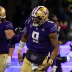Washington quarterback Michael Penix Jr. celebrates a touchdown during the first half of the team's NCAA college football game against Colorado, Saturday, Nov. 19, 2022, in Seattle. (AP Photo/Stephen Brashear)