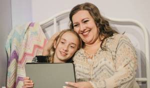 Kara (Gwynn Hawley) and her mom Jessie (Shaylyn Reed) connect with friends over Zoom in “A Miracle on 34th Street,” playing November 25-December 18 at the Red Curtain Arts Center in Marysville.