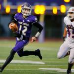 Lake Stevens Kolton Matson scrambles for a solid gain during the 4A semifinal against Graham-Kapowsin on Saturday, Nov. 26, 2022, at Lake Stevens High School in Lake Stevens, Washington. (Ryan Berry / The Herald)