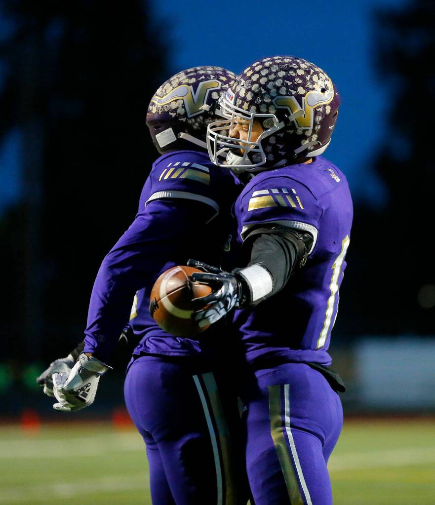 Limar celebrates after one of his five touchdown runs. (Ryan Berry / The Herald)