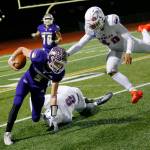 Lake Stevens Cole Becker gets taken down for a short gain during the 4A semifinal against Graham-Kapowsin on Saturday, Nov. 26, 2022, at Lake Stevens High School in Lake Stevens, Washington. (Ryan Berry / The Herald)