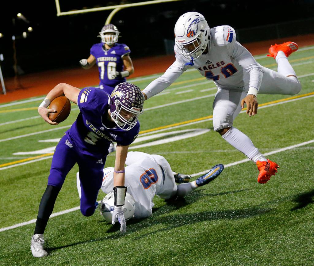 Lake Stevens Cole Becker gets taken down for a short gain during the 4A semifinal against Graham-Kapowsin on Saturday, Nov. 26, 2022, at Lake Stevens High School in Lake Stevens, Washington. (Ryan Berry / The Herald)