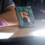 A framed photograph of Mila and Wilfrido Sarmiento is displayed during their grandsons reading of his victim impact statement to the court during Caleb Wrides sentencing on Monday, Nov. 28, 2022 in Everett, Washington. (Olivia Vanni / The Herald)