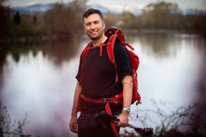 Jeff Brown at the Lowell Riverfront Trail with the Cascades visible in the distance on Thursday, April 7, 2022 in Everett, Washington. (Olivia Vanni / The Herald)