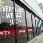Everett Vacuums new Hewitt location displays their classic Everything we sell sucks motto on the front window. (Ryan Berry / The Herald)
