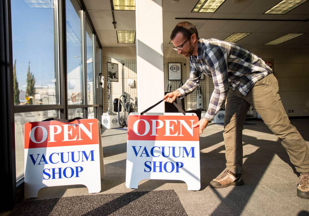 David Lane moves things around Everett Vacuums new shop on Hewitt Avenue in Everett. (Olivia Vanni / The Herald)