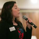 Oraia Reid from Babies of Homelessness gives a description of the organization during 100+ Women Who Care About Snohomish Countys Giving Circle meeting at the Sons of Norway Normanna Lodge in Everett. (Ryan Berry / The Herald)