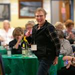 Members of 100+ Women Who Care About Snohomish County, wait to see if their raffle tickets are winners during their Giving Circle meeting at the Sons of Norway Normanna Lodge in Everett. (Ryan Berry / The Herald)