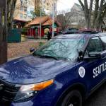 A Seattle Police vehicle sits parked at Hing Hay Park on March 18, 2021, in Seattle. (Ted S. Warren/The Associated Press)