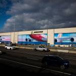 Traffic moves along Highway 526 in front of Boeings Everett Production Facility on Monday, Nov. 28, 2022 in Everett, Washington. (Olivia Vanni / The Herald)