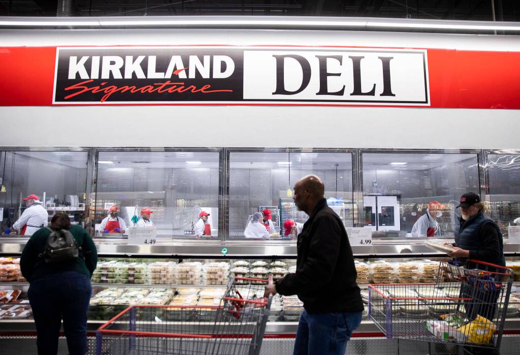 A Costco employee says the Issaquah-based company strives to make shopping at its stores an experience. (Olivia Vanni / The Herald)