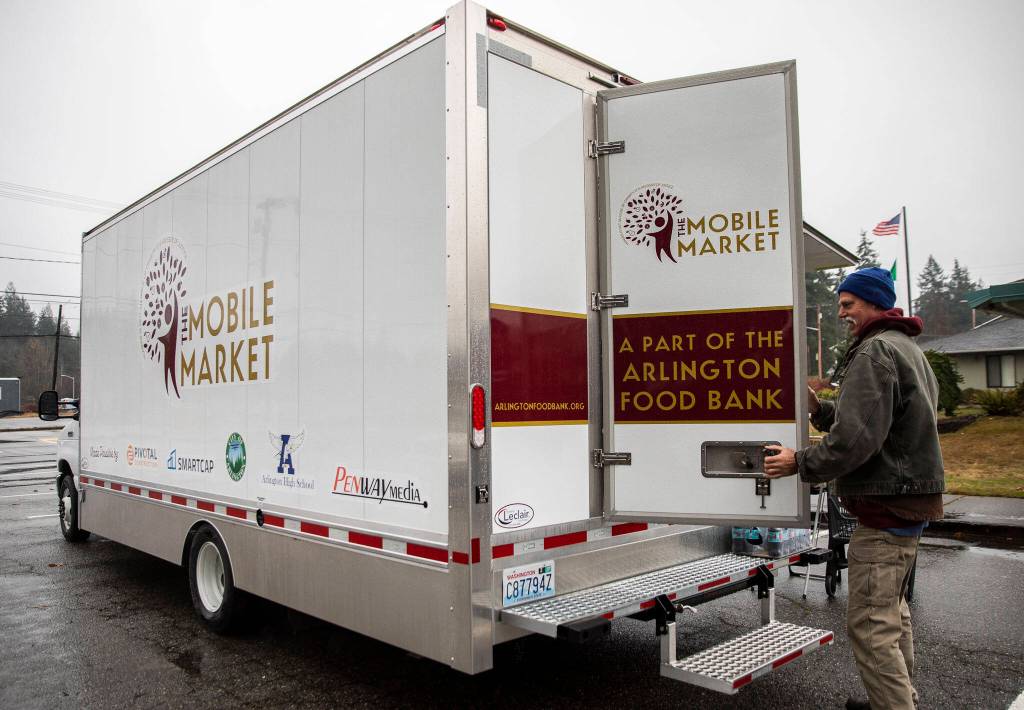 The Arlington Food Banks Mobile Market truck on Nov. 22, in Arlington. (Olivia Vanni / The Herald)