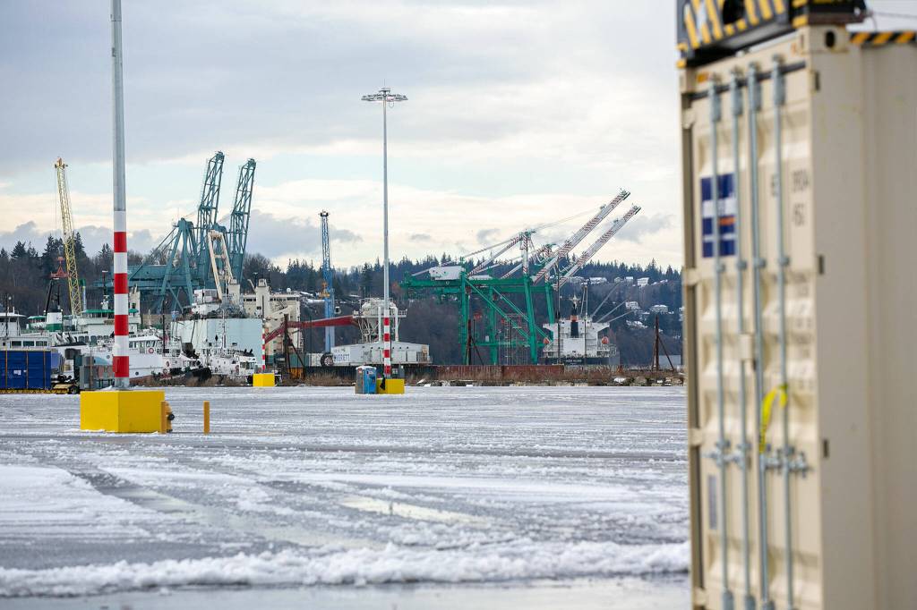 Cranes at the Port of Everett South Terminal are seen beyond the new Norton Terminal on Thursday, Dec. 1, 2022, at the Port of Everett in Everett, Washington. (Ryan Berry / The Herald)