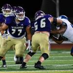 Lake Stevens Jayden Limar (rear) looks downfield behind the blocking of teammates Aaron Parker (77) and Ashten Hendrickson (66) during a game against Federal Way on Friday, Sept. 16, 2022, at Lake Stevens High School. (John Gardner / Pro Action Image)