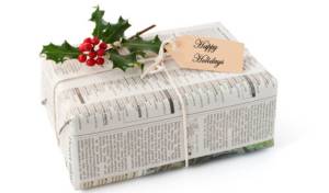 Christmas present gift wrapped in mews paper  tide with string.