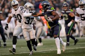 Seattle Seahawks running back Kenneth Walker III (9) running with the ball during an NFL football game against the Las Vegas Raiders, Sunday, Nov. 27, 2022, in Seattle, WA. The Raiders defeated the Seahawks 40-34. (AP Photo/Ben VanHouten)