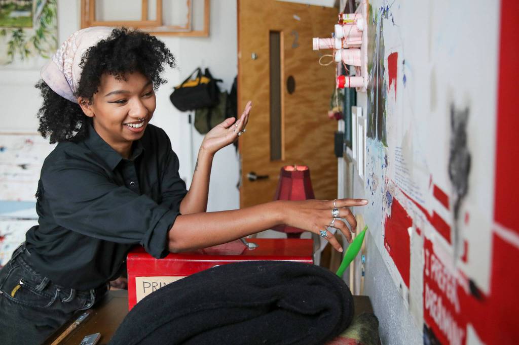 Mahllie Beck specializes in acrylic painting and interior murals. (Kevin Clark / The Herald)