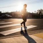 A pedestrian uses the cross walk at 30th Street NE along 113th Avenue NE near Lake Stevens High School on Nov. 14, in Lake Stevens. (Olivia Vanni / The Herald file photo)