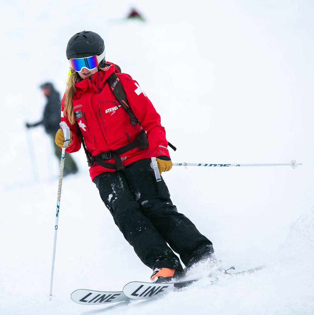 A member of the ski patrol heads down the mountain. (Ryan Berry / The Herald)