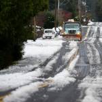 A snow plow clears snow off of 92nd Avenue West on Wednesday, Nov. 30, 2022, in Edmonds, Washington. (Olivia Vanni / The Herald)