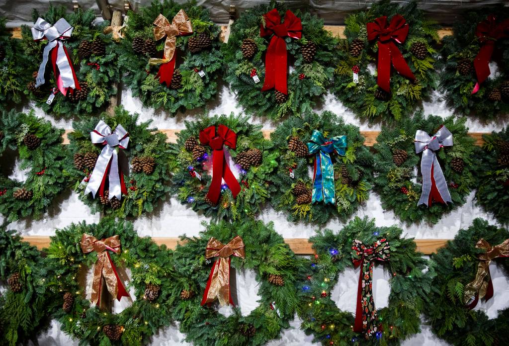 Finished wreaths in multiple styles available for purchase from Montano Family Wreaths on Dec. 5, in Monroe. (Olivia Vanni / The Herald)