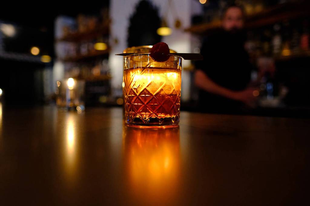The Razzle-Dazzle Milk Punch ($14) at LJs Bistro in Lake Stevens, with elderberry gin, raspberry, Pimms and green tea. Friday, April 29, 2022. (Taylor Goebel / The Herald)