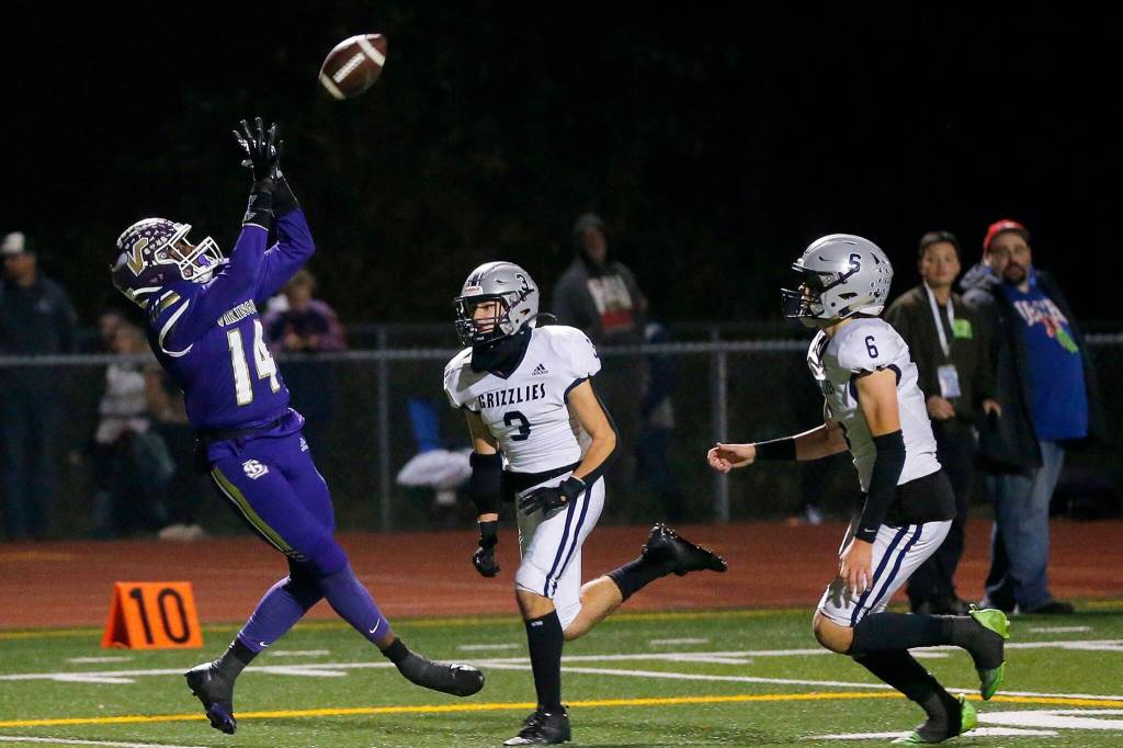 Lake Stevens’ Isaac Redford leans back to take in a reception before going down at the 1 yard line against Glacier Peak on Friday, Oct. 28, 2022, at Lake Stevens High School in Lake Stevens, Washington. (Ryan Berry / The Herald)