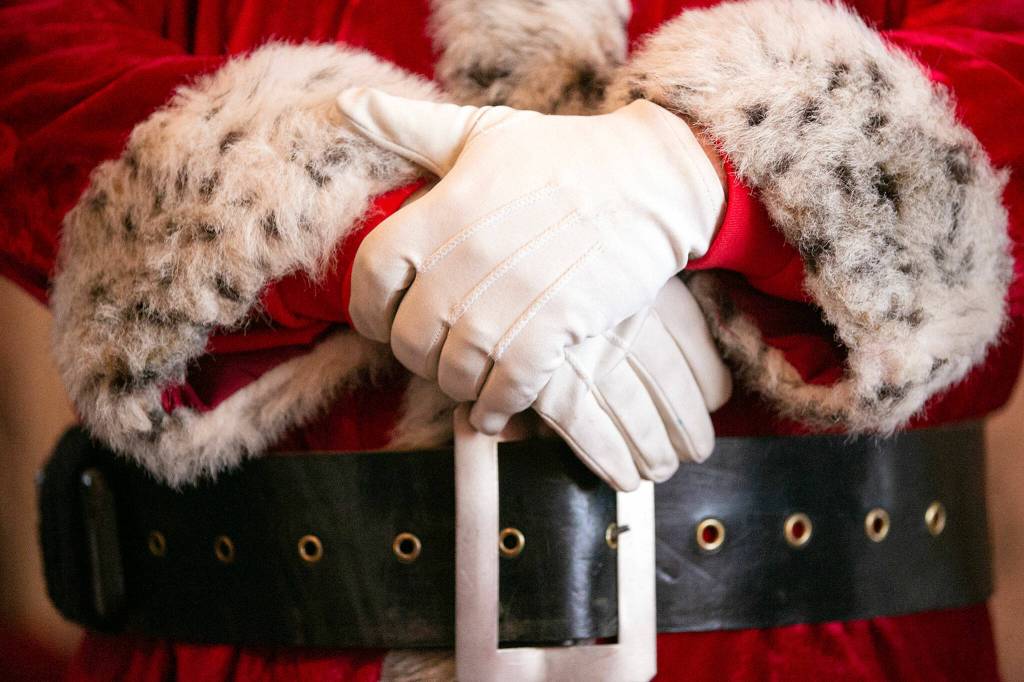 Santa Brett Nichols wears the Santa suit he inherited from his father on Dec. 4, in Monroe. Nichols said he first started wearing the suit to do small favors for friends before he eventually become known around the area as the Sultan Santa. (Ryan Berry / The Herald)