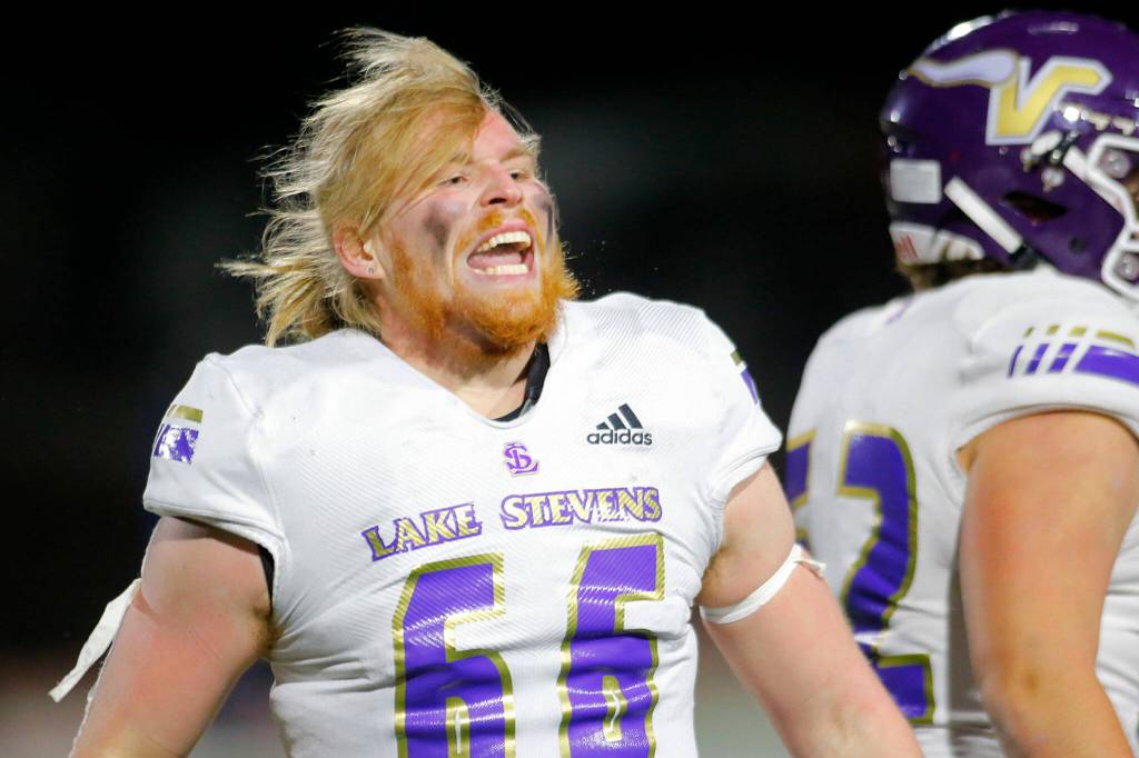 Lake Stevens Ashten Hendrickson celebrates an opening-drive interception against Kennedy Catholic in the Class 4A state championship game Saturday at Mount Tahoma Stadium in Tacoma. (Ryan Berry / The Herald)