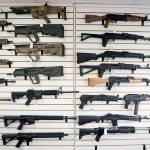 Semi-automatic rifles fill a wall at a gun shop on Oct. 2, 2018, in Lynnwood. (AP Photo / Elaine Thompson, File)