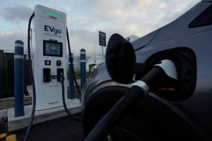 An electric vehicle charges at an EVgo fast charging station in Detroit, Wednesday, Nov. 16, 2022. (AP Photo/Paul Sancya)