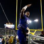 Washington quarterback Michael Penix Jr. (9) celebrates as he leaves Autzen Stadium after defeating Oregon on Nov. 12 in Eugene, Ore. (AP Photo/Andy Nelson)